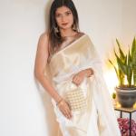 Symmetrical Beige Soft Silk Saree With Cynosure Blouse Piece