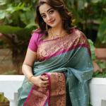Dissemble Sea Green Soft Silk Saree With Pleasant Blouse Piece