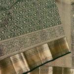 Eloquence Dark Green Soft Banarasi Silk Saree With Engrossing Blouse Piece