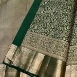 Eloquence Dark Green Soft Banarasi Silk Saree With Engrossing Blouse Piece