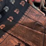 Gratifying Black Soft Banarasi Silk Saree With Intricate Blouse Piece