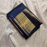 Engrossing Navy Blue Soft Banarasi Silk Saree With Gratifying Blouse Piece