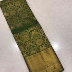 Divine Dark Green Soft Banarasi Silk Saree With Entrancing Blouse Piece