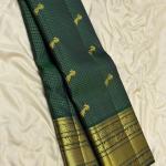 Divine Dark Green Pure Zari Weaving Banarasi Silk Saree With Diaphanous Blouse Piece
