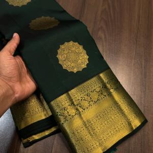 Eloquence Dark Green Pure Zari Weaving Banarasi Silk Saree With Bewitching Blouse Piece