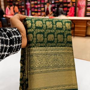 Intricate Dark Green Pure Banarasi Silk Saree With Gratifying Blouse Piece