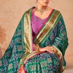 Murmurous Green Patola Silk Saree with Sophisticated Blouse Piece