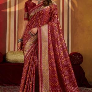Staring Maroon Patola Silk Saree with Precious Blouse Piece