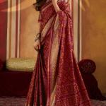 Staring Maroon Patola Silk Saree with Precious Blouse Piece
