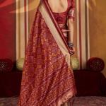 Staring Maroon Patola Silk Saree with Precious Blouse Piece