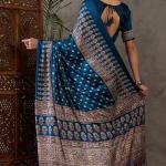 Sumptuous Rama Ajrakh Printed Semi Modal Silk Saree With Staggering Blouse Piece