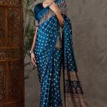 Sumptuous Rama Ajrakh Printed Semi Modal Silk Saree With Staggering Blouse Piece