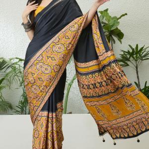 Jubilant Black Ajrakh Printed Semi Modal Silk Saree With Surpassing Blouse Piece