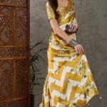 Super extravagant Mustard Ajrakh Printed Semi Modal Silk Saree With Demesne Blouse Piece
