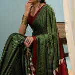 Transcendent Dark Green Ajrakh Printed Semi Modal Silk Saree With Winsome Blouse Piece