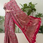 Snazzy Dark Pink Ajrakh Printed Semi Modal Silk Saree With Serendipity Blouse Piece