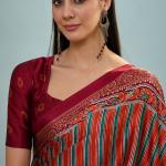 Enigmatic Red Ajrakh Printed Semi Modal Silk Saree With Blissful Blouse Piece