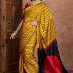 Sensational Yellow Ajrakh Printed Semi Modal Silk Saree With Resonant Blouse Piece