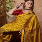 Sensational Yellow Ajrakh Printed Semi Modal Silk Saree With Resonant Blouse Piece
