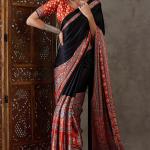Enticing Black Ajrakh Printed Semi Modal Silk Saree With Winsome Blouse Piece