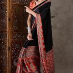 Enticing Black Ajrakh Printed Semi Modal Silk Saree With Winsome Blouse Piece