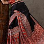 Enticing Black Ajrakh Printed Semi Modal Silk Saree With Winsome Blouse Piece