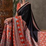 Enticing Black Ajrakh Printed Semi Modal Silk Saree With Winsome Blouse Piece