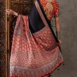 Enticing Black Ajrakh Printed Semi Modal Silk Saree With Winsome Blouse Piece