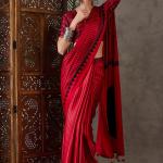Ornate Red Ajrakh Printed Semi Modal Silk Saree With Alluring Blouse Piece