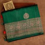 Surpassing Dark Green Soft Silk Saree With Dazzling Blouse Piece