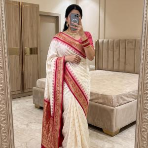 Twirling Off White Pure Banarasi Silk Saree With Beleaguer Blouse Piece