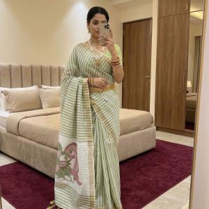 Symmetrical Pista Linen Silk Saree With Cynosure Blouse Piece
