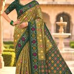 Engaging Green Patola Silk Saree with Smart Blouse Piece