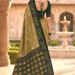 Engaging Green Patola Silk Saree with Smart Blouse Piece