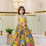 Girls Premium Yellow Printed Ethnic Gown with Pink Pleated Flair