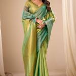 Murmurous Green Banarasi Tissue Silk Saree With Sonorous Blouse Piece