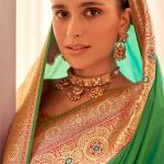 Fugacious Dark Green Soft Banarasi Silk Saree With Opulent Blouse Piece