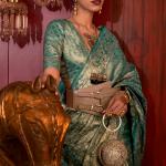Stunning Rama Soft Banarasi Silk Saree With Energetic Blouse Piece