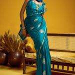 Smashing Rama Banarasi Satin Silk Saree With Effulgent Blouse