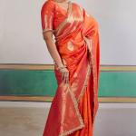 Proficient Orange Pure Zari Weaving Banarasi Silk Saree With Fancy Lace Border