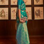 Pleasant Rama Kanjivaram Silk Saree With Ravishing Blouse Piece