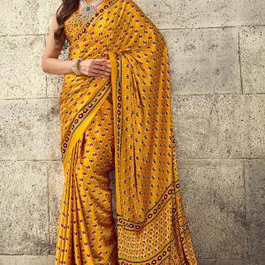 Gratifying Mustard Ajrakh Printed Satin Silk Saree With Enthralling Blouse Piece