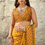 Gratifying Mustard Ajrakh Printed Satin Silk Saree With Enthralling Blouse Piece