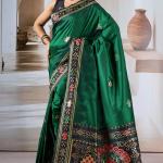 Seraphic Dark Green Patola Silk Saree with Extraordinary Blouse Piece