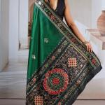 Seraphic Dark Green Patola Silk Saree with Extraordinary Blouse Piece