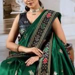 Seraphic Dark Green Patola Silk Saree with Extraordinary Blouse Piece