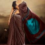 Eloquence Brown Ajrakh Printed Semi Modal Silk Saree With Mesmerising Blouse Piece