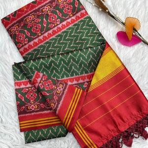 Jubilant Dark Green Ikkat Printed Patola Silk Saree With Entrancing Blouse Piece