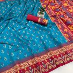 Symmetrical Firozi Banarasi Ikkat Silk Saree With Cynosure Blouse Piece