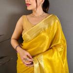 Unique Golden Banarasi Tissue Silk Saree With Diaphanous Blouse Piece